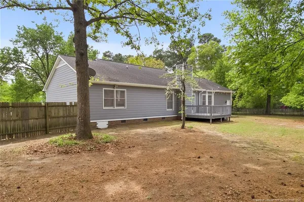 a house with a tree in the background