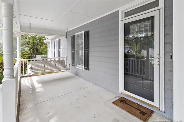 a view of a hallway with a glass door and glass door