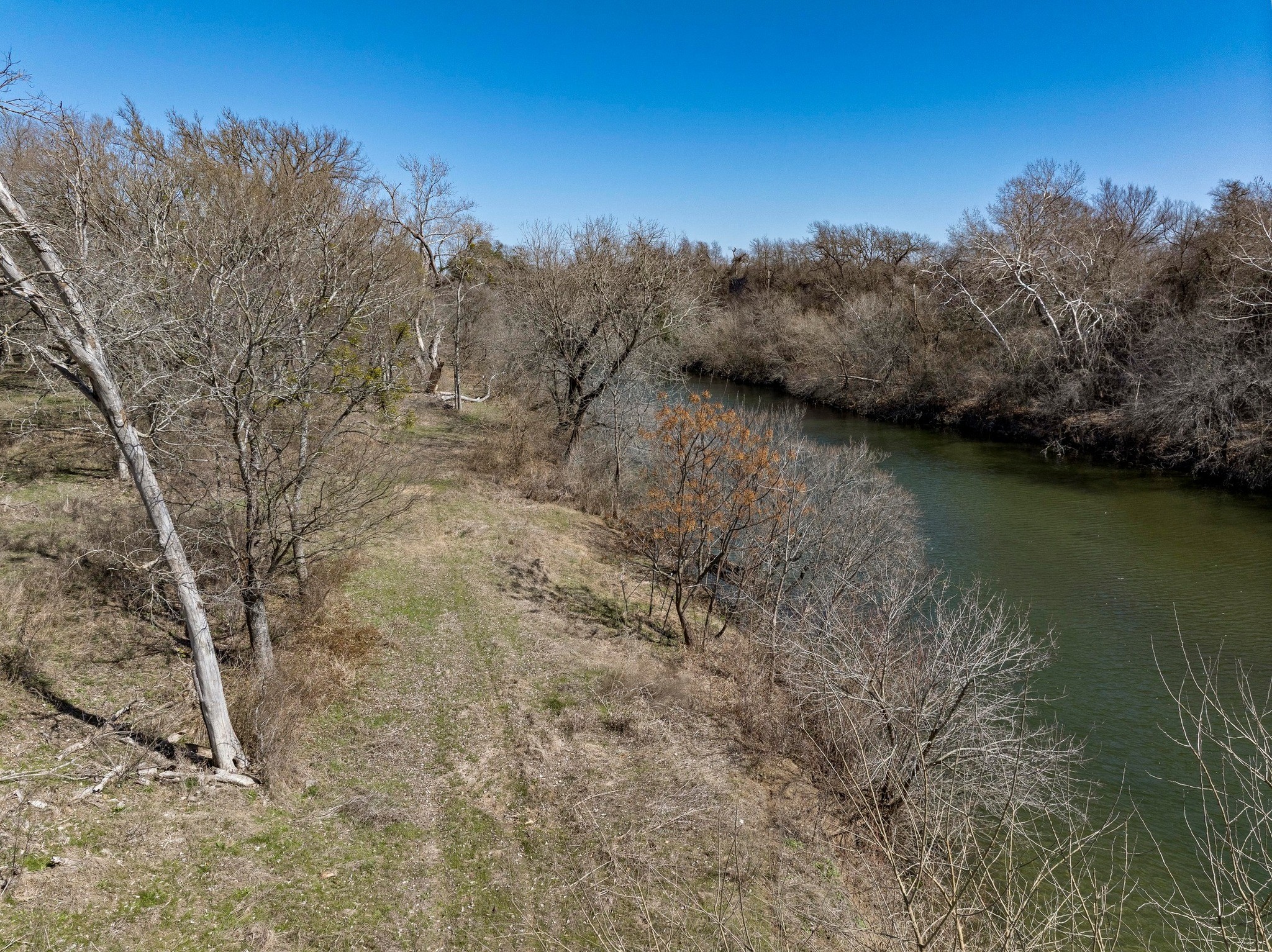 105 River Valley Drive Georgetown, TX 78626 - Photo 4 of 29 a view of a lake with a mountain in the background