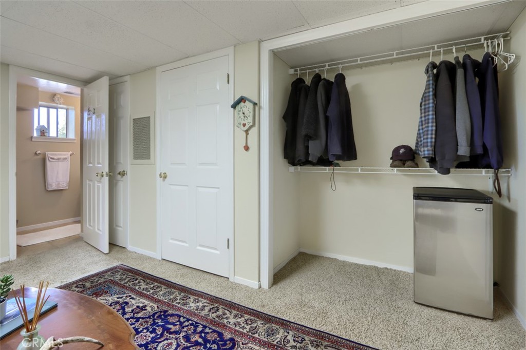5027 Fox Creek Road Mariposa, CA 95338 - Photo 27 of 75 a view of walk in closet with clothes and shoes