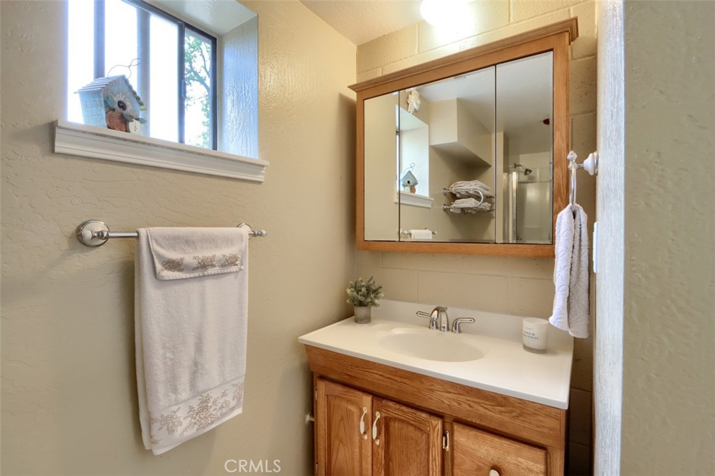 5027 Fox Creek Road Mariposa, CA 95338 - Photo 28 of 75 a bathroom with a sink and a mirror