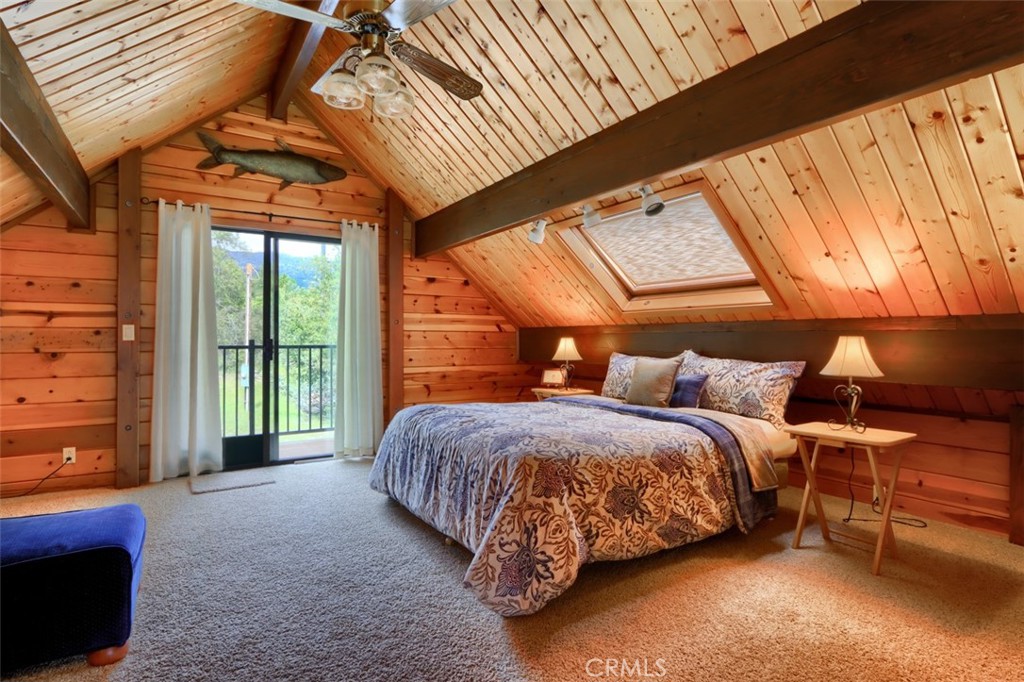 5027 Fox Creek Road Mariposa, CA 95338 - Photo 31 of 75 a bed sitting in a bedroom next to a window