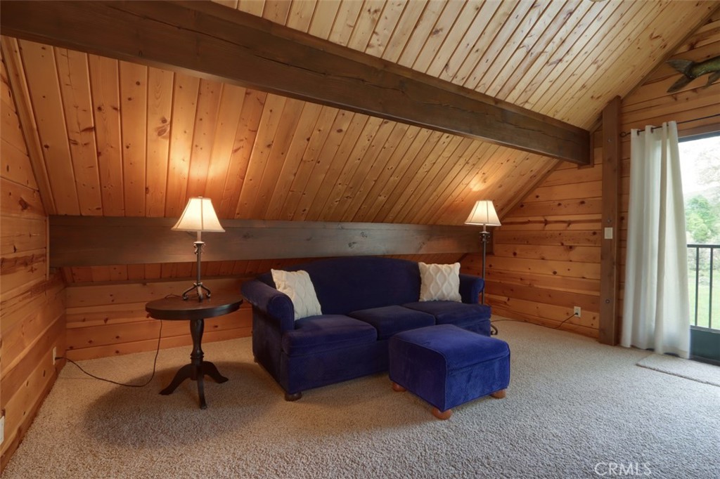 5027 Fox Creek Road Mariposa, CA 95338 - Photo 32 of 75 a living room with furniture a lamp and a window