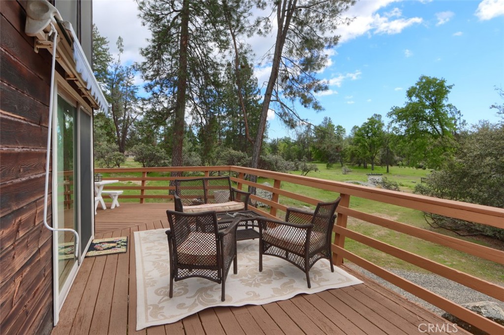 5027 Fox Creek Road Mariposa, CA 95338 - Photo 36 of 75 a view of a chairs and table on the wooden floor