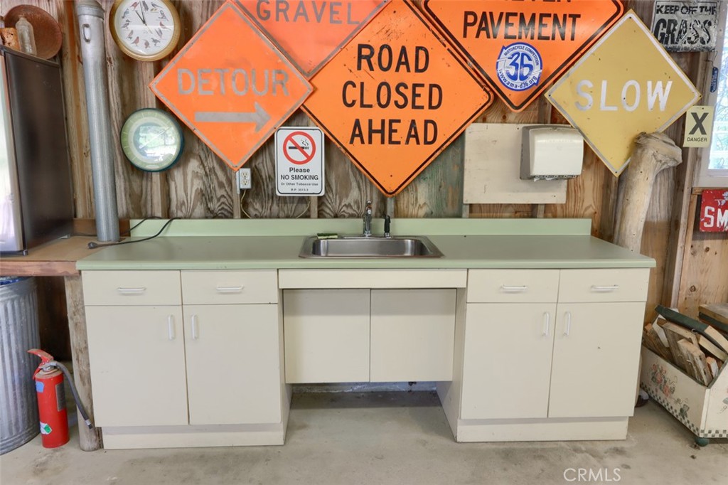 5027 Fox Creek Road Mariposa, CA 95338 - Photo 53 of 75 a utility room with a sink and a cabinets
