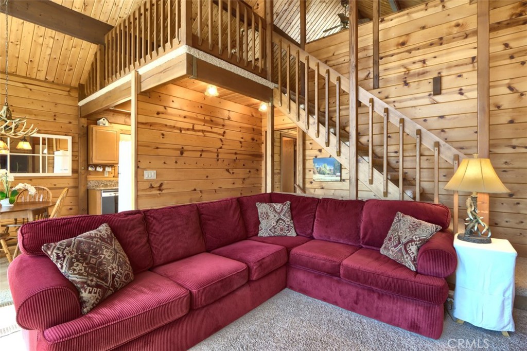 5027 Fox Creek Road Mariposa, CA 95338 - Photo 8 of 75 a living room with furniture a couch and a chandelier