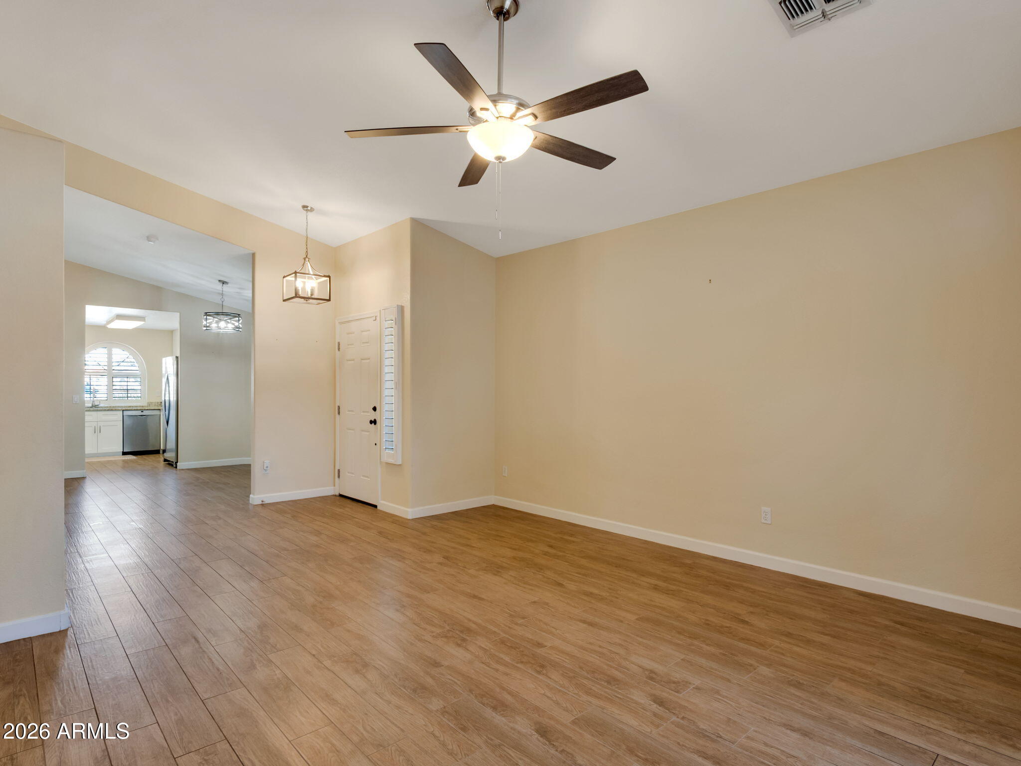 9151 West Boca Raton Road Peoria, AZ 85381 - Photo 3 of 14 Great room looking toward the kitchen