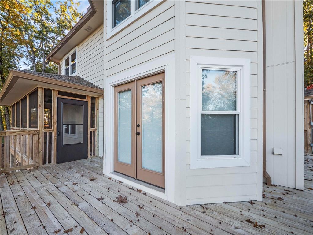 6185 Timberidge Drive Gainesville, GA 30506 - Photo 20 of 50 a front view of a house with a wooden balcony