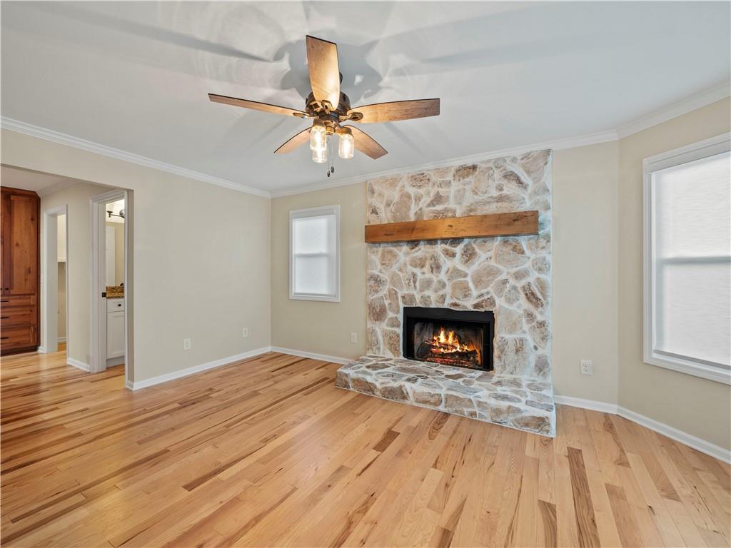 6185 Timberidge Drive Gainesville, GA 30506 - Photo 22 of 50 wooden floor fireplace and windows in an empty room