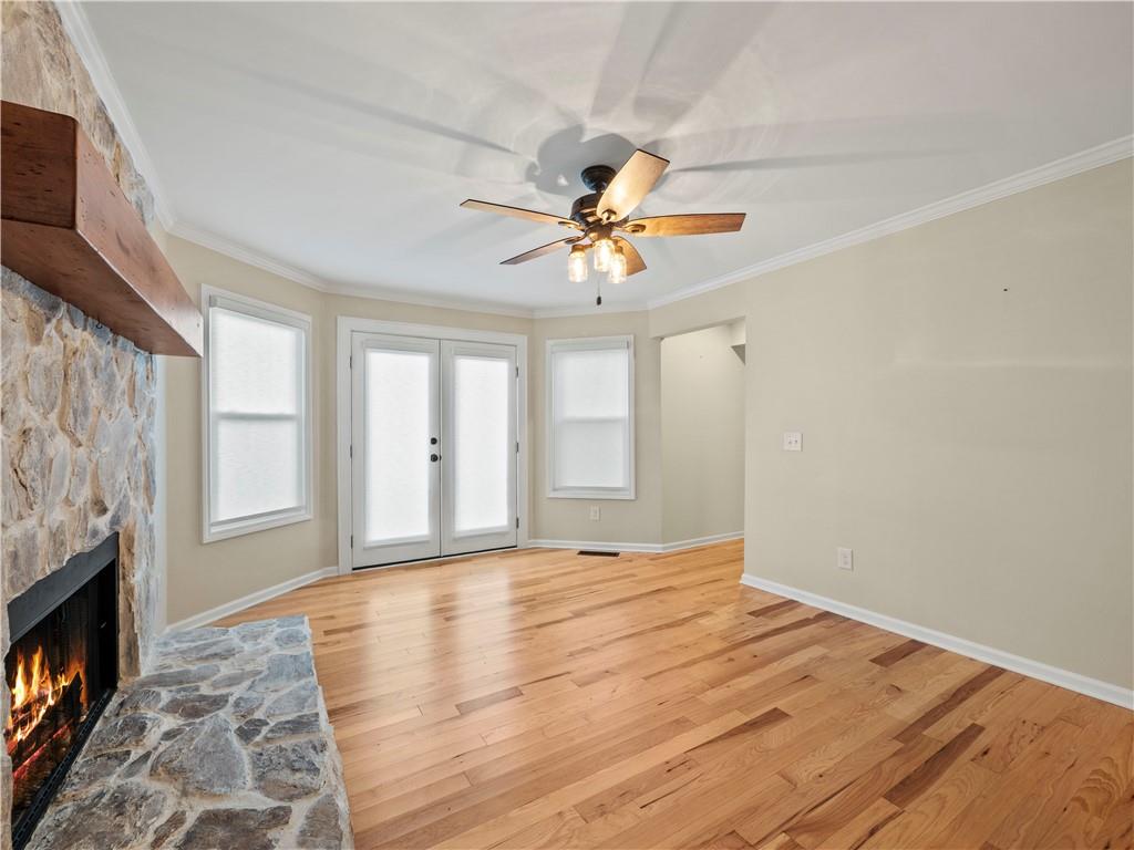 6185 Timberidge Drive Gainesville, GA 30506 - Photo 23 of 50 a view of empty room with fireplace and fan