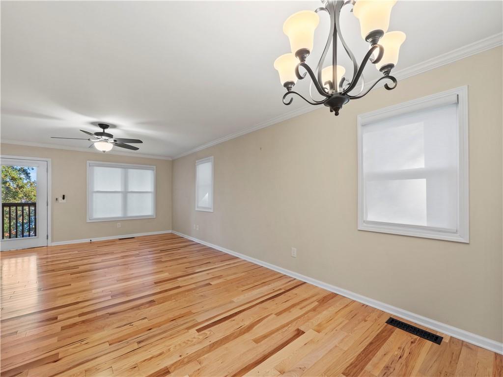 6185 Timberidge Drive Gainesville, GA 30506 - Photo 28 of 50 a view of empty room with wooden floor and fan