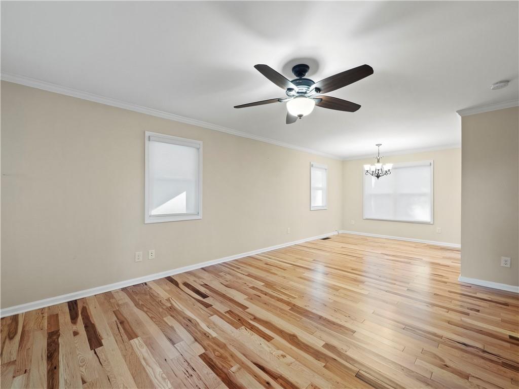 6185 Timberidge Drive Gainesville, GA 30506 - Photo 31 of 50 a view of empty room with wooden floor and fan