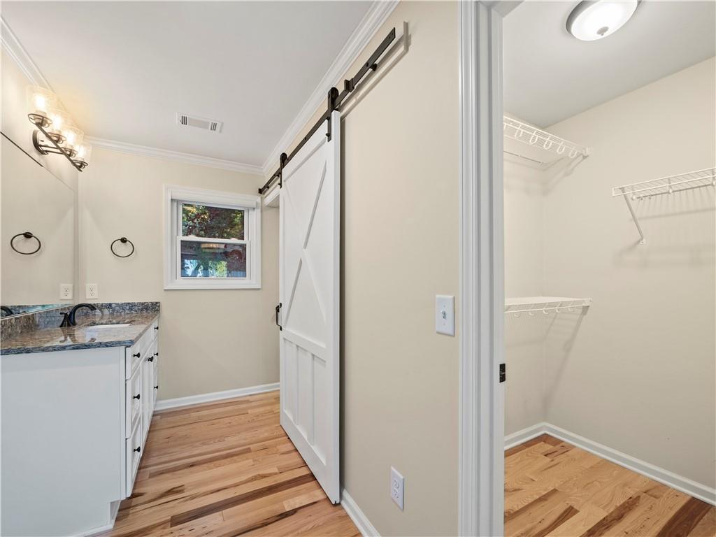 6185 Timberidge Drive Gainesville, GA 30506 - Photo 37 of 50 a view of a hallway with wooden floor and staircase