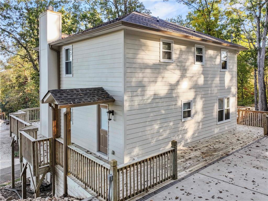 6185 Timberidge Drive Gainesville, GA 30506 - Photo 9 of 50 a side view of a house with wooden fence