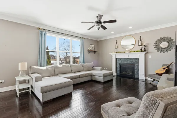 a living room with furniture and a fireplace