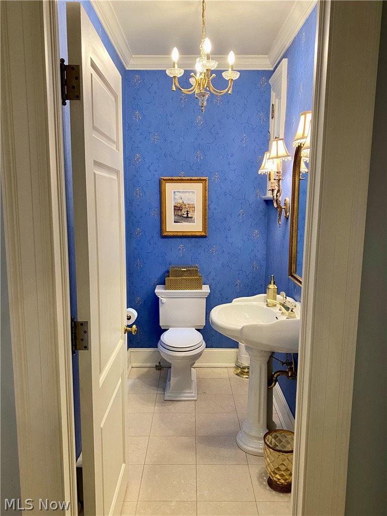 1984 Stockbridge Road Akron, OH 44313 - Photo 14 of 35 This beautiful half bath located off the grand hall features a a pedestal sink, sconces flanking a decorative mirror and a chandelier.
