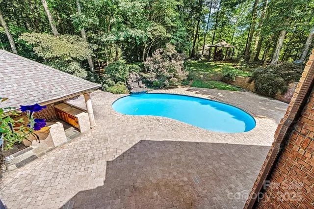 a view of outdoor space and swimming pool
