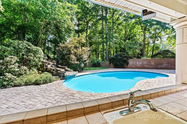 a view of a swimming pool with a patio