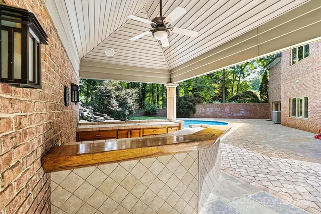 a view of swimming pool with seating space