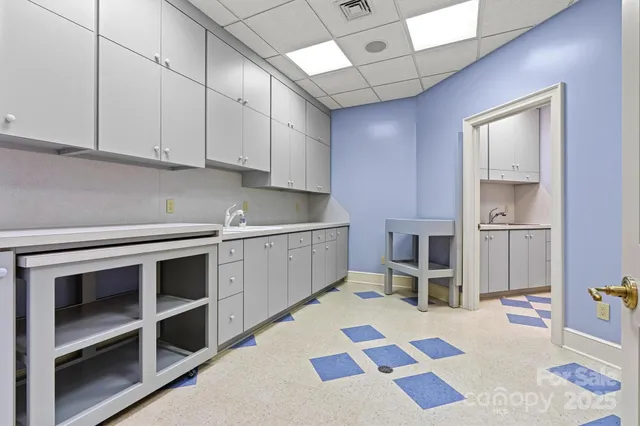 a kitchen with a cabinets and appliances