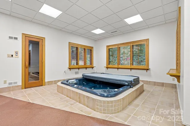 a view of a livingroom with an empty space and a fireplace