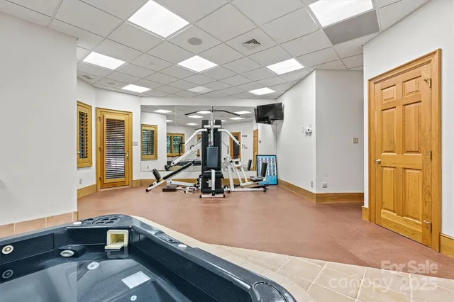 a kitchen with granite countertop a refrigerator and a sink