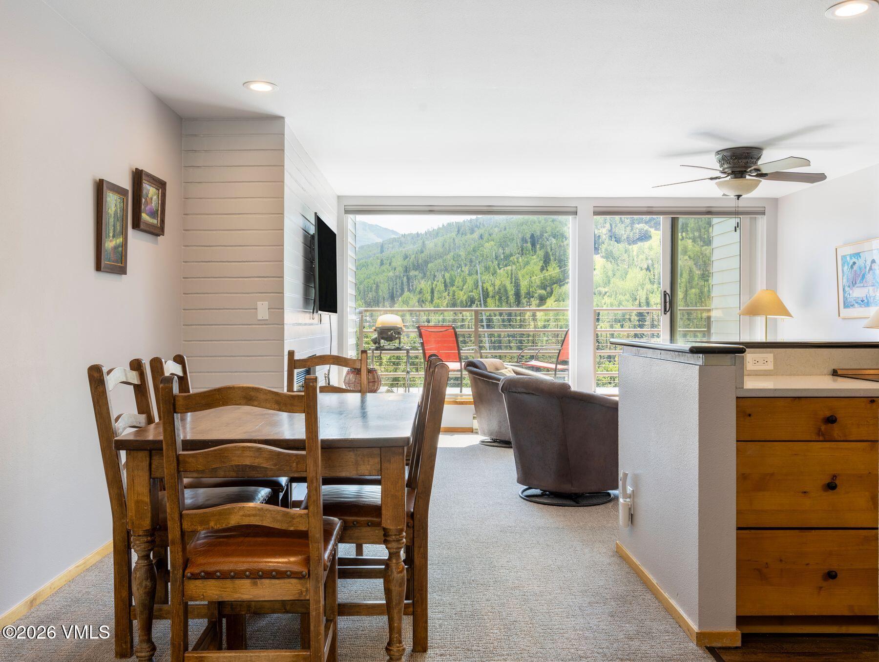 1100 North Frontage Road West, Unit 1503 Vail, CO 81657 - Photo 12 of 32 a view of a dining room with furniture window and outside view