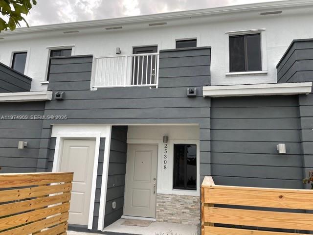 25308 Southwest 135th Avenue Homestead, FL 33032 - Photo 1 of 25 a view of building with stairs