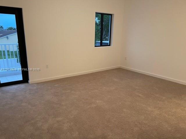 25308 Southwest 135th Avenue Homestead, FL 33032 - Photo 14 of 25 a view of an empty room with a window