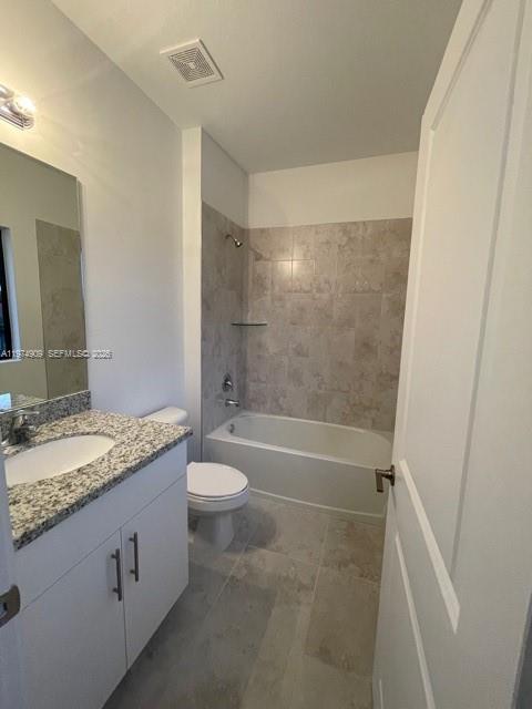 25308 Southwest 135th Avenue Homestead, FL 33032 - Photo 16 of 25 a bathroom with a granite countertop sink toilet and shower