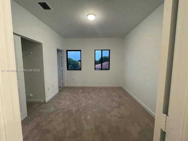 25308 Southwest 135th Avenue Homestead, FL 33032 - Photo 17 of 25 an empty room with windows and closet