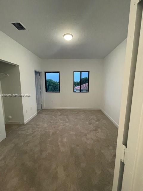 25308 Southwest 135th Avenue Homestead, FL 33032 - Photo 18 of 25 an empty room with windows