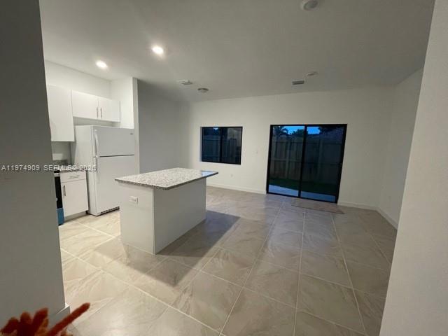 25308 Southwest 135th Avenue Homestead, FL 33032 - Photo 21 of 25 a large room with a table and a sink