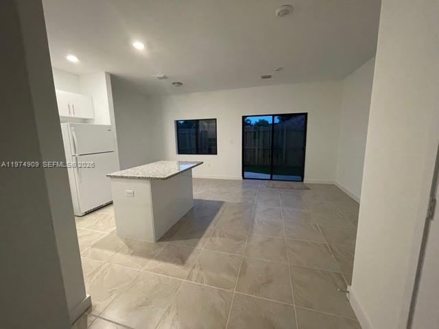 25308 Southwest 135th Avenue Homestead, FL 33032 - Photo 25 of 25 a view of a living room with furniture and a flat screen tv