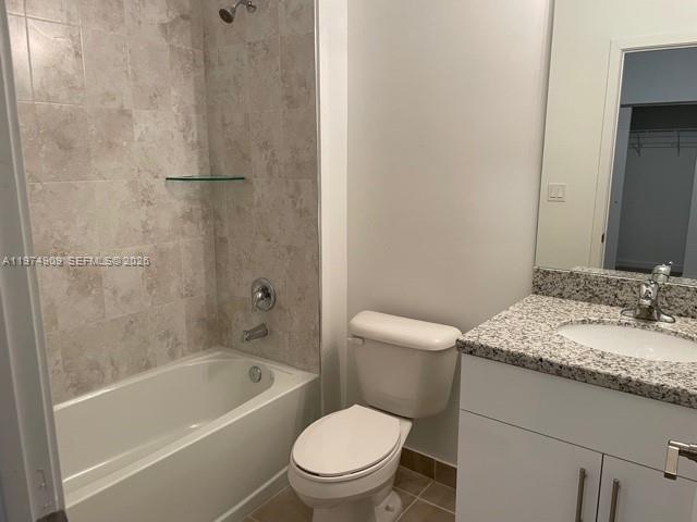 25308 Southwest 135th Avenue Homestead, FL 33032 - Photo 8 of 25 a bathroom with a granite countertop toilet a sink and bathtub