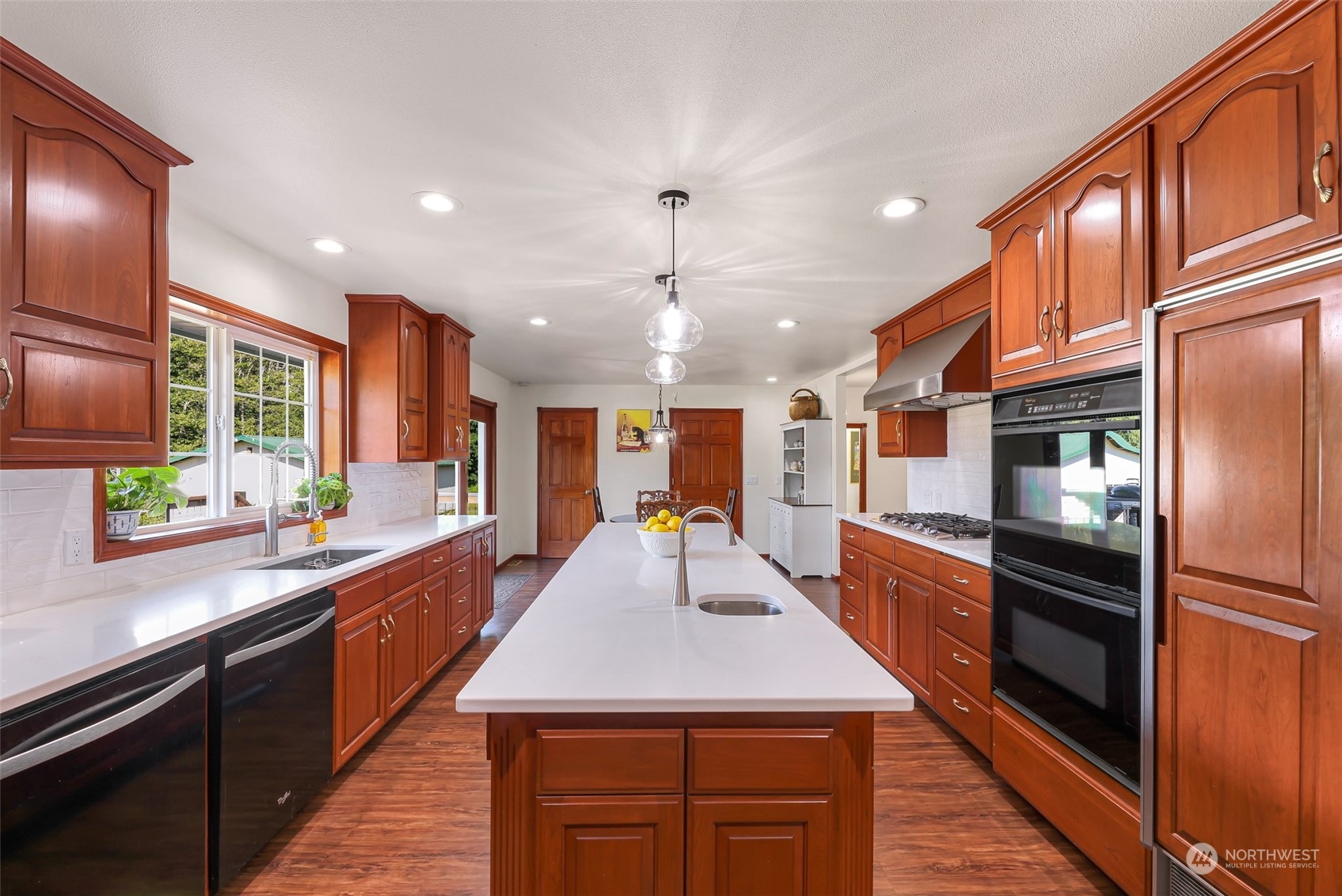 2756 Brown Road Ferndale, WA 98248 - Photo 11 of 35 a large kitchen with stainless steel appliances kitchen island granite countertop a large kitchen island and a refrigerator