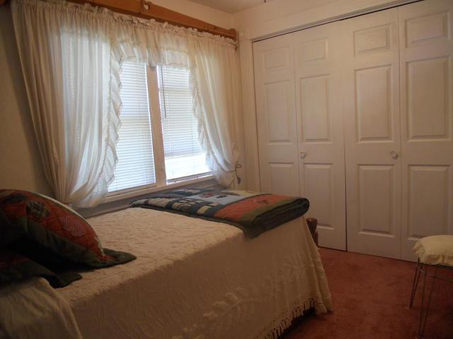 18442 East Twombly Road Rochelle, IL 61068 - Photo 12 of 20 a bedroom with a bed and a window