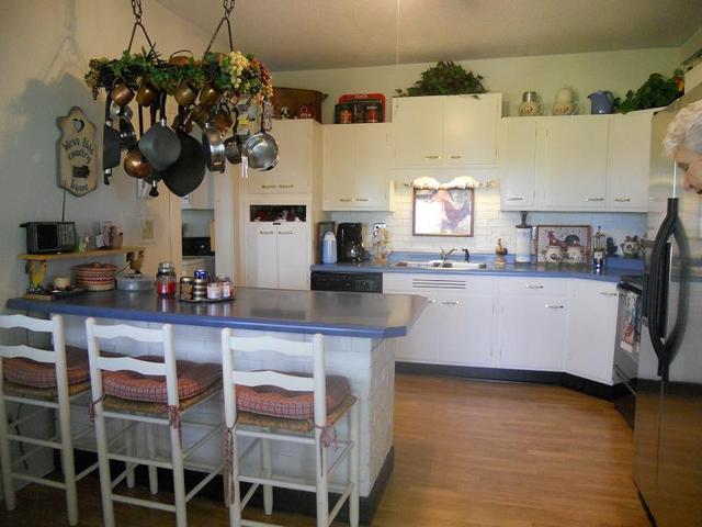 18442 East Twombly Road Rochelle, IL 61068 - Photo 3 of 20 a kitchen with a sink cabinets and window
