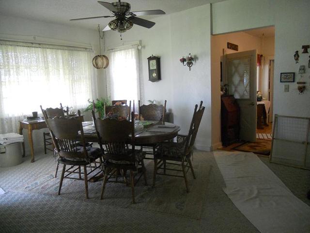 18442 East Twombly Road Rochelle, IL 61068 - Photo 4 of 20 a view of a dining room with furniture and a window