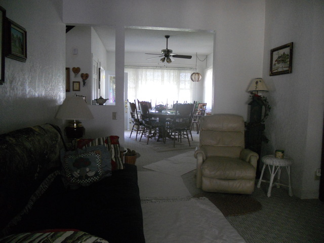 18442 East Twombly Road Rochelle, IL 61068 - Photo 5 of 20 a living room with furniture and a chandelier