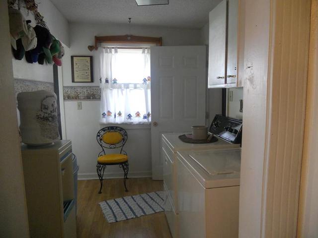 18442 East Twombly Road Rochelle, IL 61068 - Photo 9 of 20 a bathroom with a sink toilet and window