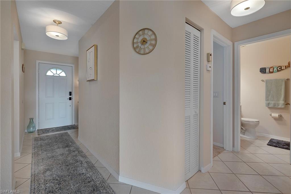 379 Gabriel Circle, Unit 2304 Naples, FL 34104 - Photo 11 of 23 a view of a hallway with elevator