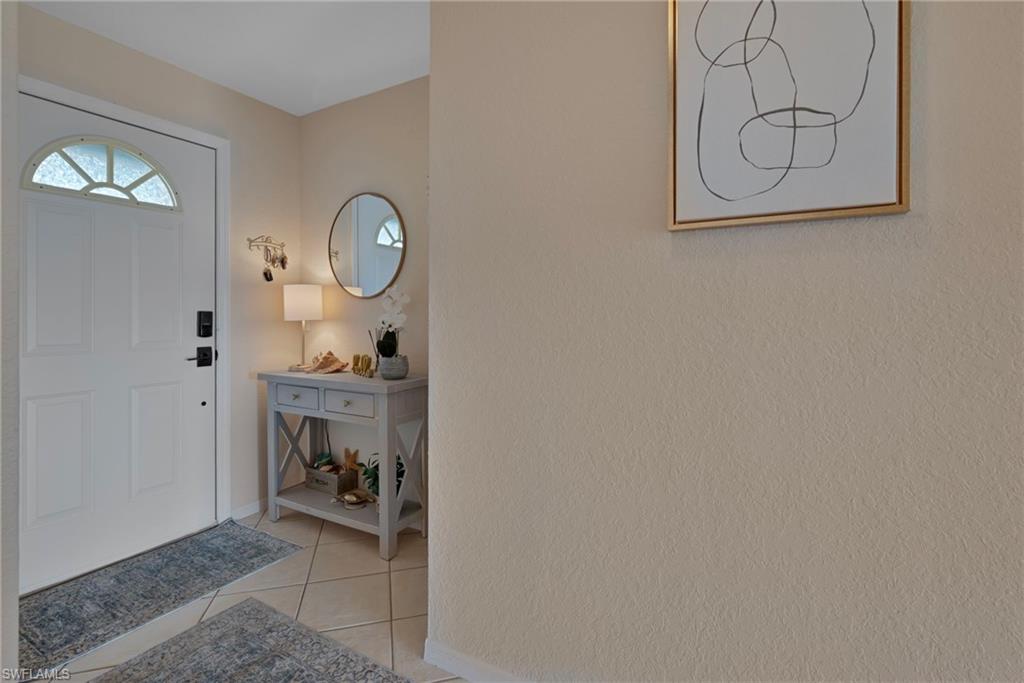 379 Gabriel Circle, Unit 2304 Naples, FL 34104 - Photo 14 of 23 a view of room with workspace and mirror