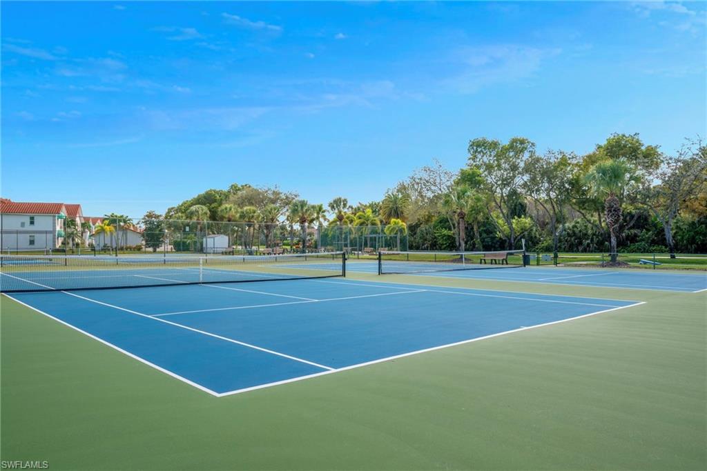 379 Gabriel Circle, Unit 2304 Naples, FL 34104 - Photo 21 of 23 a view of a tennis court