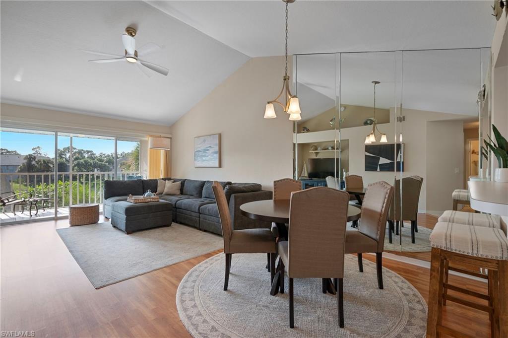 379 Gabriel Circle, Unit 2304 Naples, FL 34104 - Photo 3 of 23 a living room with furniture fireplace and a large window