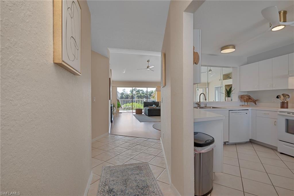 379 Gabriel Circle, Unit 2304 Naples, FL 34104 - Photo 7 of 23 a view of a storage & utility room with cabinets