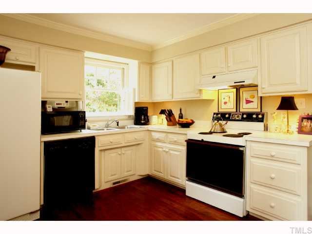 2825 Van Dyke Avenue Raleigh, NC 27607 - Photo 6 of 12 The Kitchen is very large and has recessed lights, new hardwood floors, wood shutters, large pantry and 3 windows! Great views of the fenced in backyard from the double window at the kitchen table.