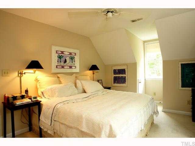 2825 Van Dyke Avenue Raleigh, NC 27607 - Photo 10 of 12 The large master bedroom has new paint, large WIC, ceiling fan and 2 attic storage knee wall storage spaces!
