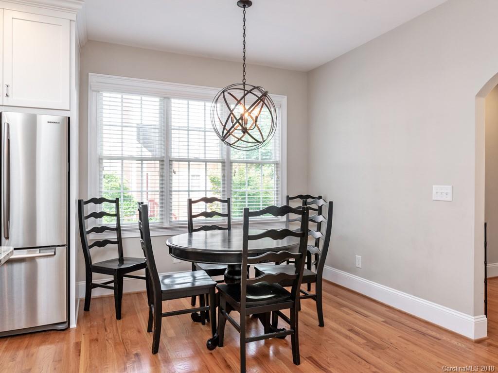 1148 Market Street Fort Mill, SC 29708 - Photo 11 of 25 a dining room with furniture a chandelier and wooden floor