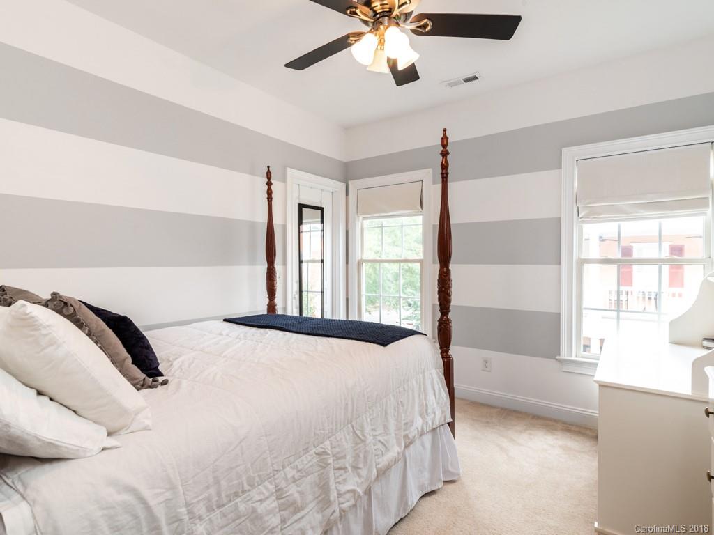 1148 Market Street Fort Mill, SC 29708 - Photo 17 of 25 a bedroom with a large bed and a large window